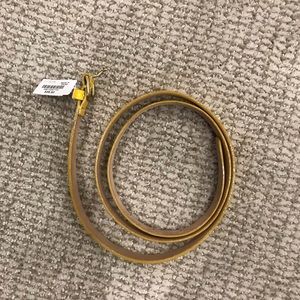 Yellow patent leather belt